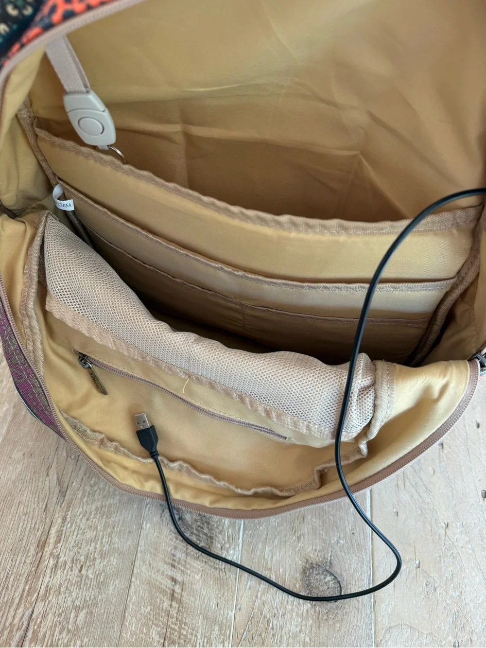 Kinmac Patterned Teal & Orange Backpack with builtin charger